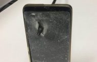 Australian man blocks arrow with mobile phone